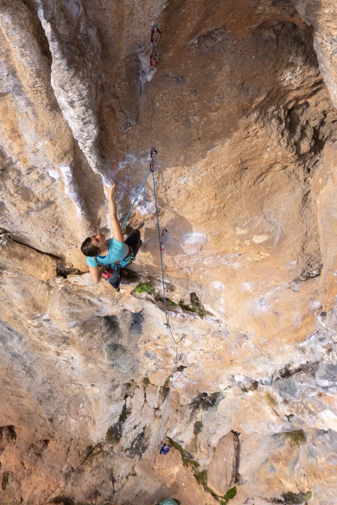 Girl climbing a tufa route in Geyikbayiri